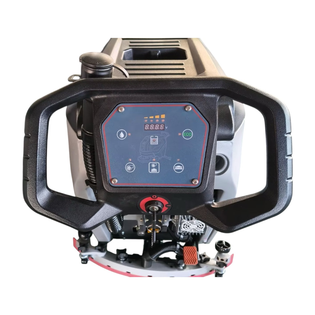 Een grijze Stahlwelle Germany E-500SW schrobzuigmachine, schuin van achteren gefotografeerd tegen een witte achtergrond. De machine heeft een handvat voor bediening, wielen voor transport en een zwarte borstelkop aan de onderzijde. Het Stahlwelle logo en de modelnaam "E-500SW" zijn zichtbaar op de zijkant. Deze compacte schrobzuigmachine is geschikt voor het reinigen van middelgrote oppervlakken.