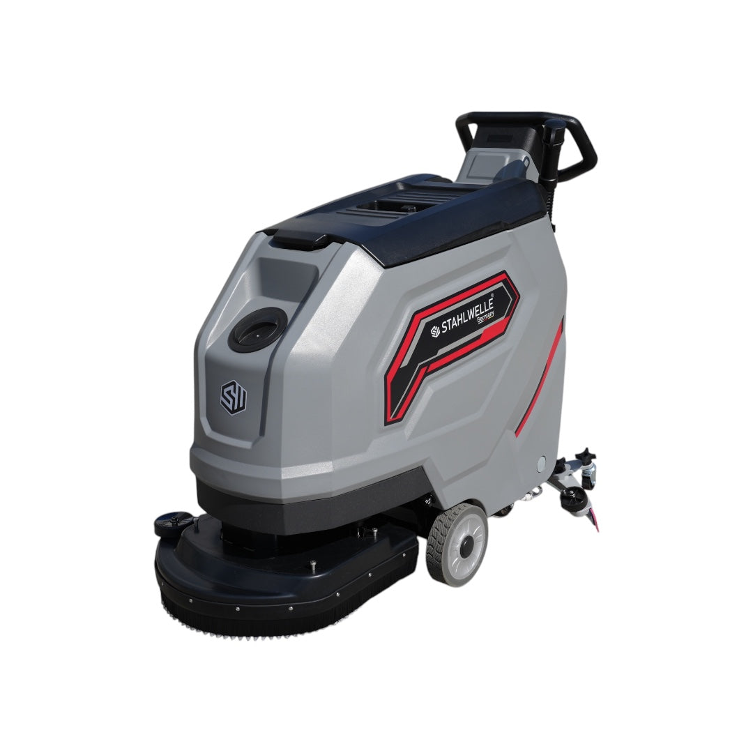 Een grijze Stahlwelle Germany E-500SW schrobzuigmachine, schuin van achteren gefotografeerd tegen een witte achtergrond. De machine heeft een handvat voor bediening, wielen voor transport en een zwarte borstelkop aan de onderzijde. Het Stahlwelle logo en de modelnaam "E-500SW" zijn zichtbaar op de zijkant. Deze compacte schrobzuigmachine is geschikt voor het reinigen van middelgrote oppervlakken.