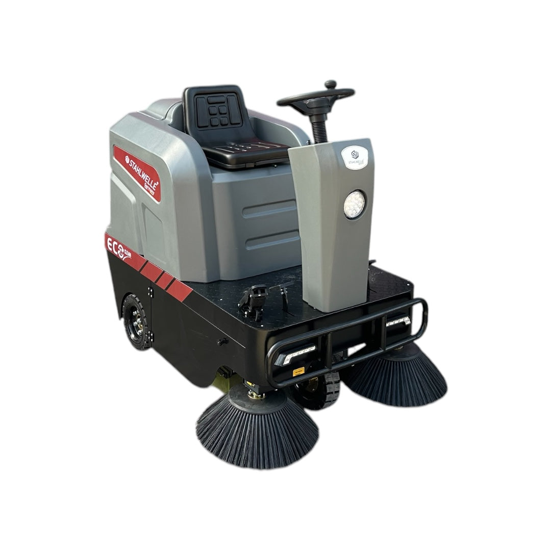 Een grijze Stahlwelle Germany E-800SW schrobzuigmachine, schuin van achteren gefotografeerd tegen een witte achtergrond. De machine heeft een duwboom met handvat voor bediening, wielen voor transport en een zwarte borstelkop aan de onderzijde. Het Stahlwelle logo en de modelnaam "E-800SW" zijn zichtbaar op de zijkant. Deze schrobzuigmachine is ontworpen voor het efficiënt reinigen van middelgrote tot grote oppervlakken.